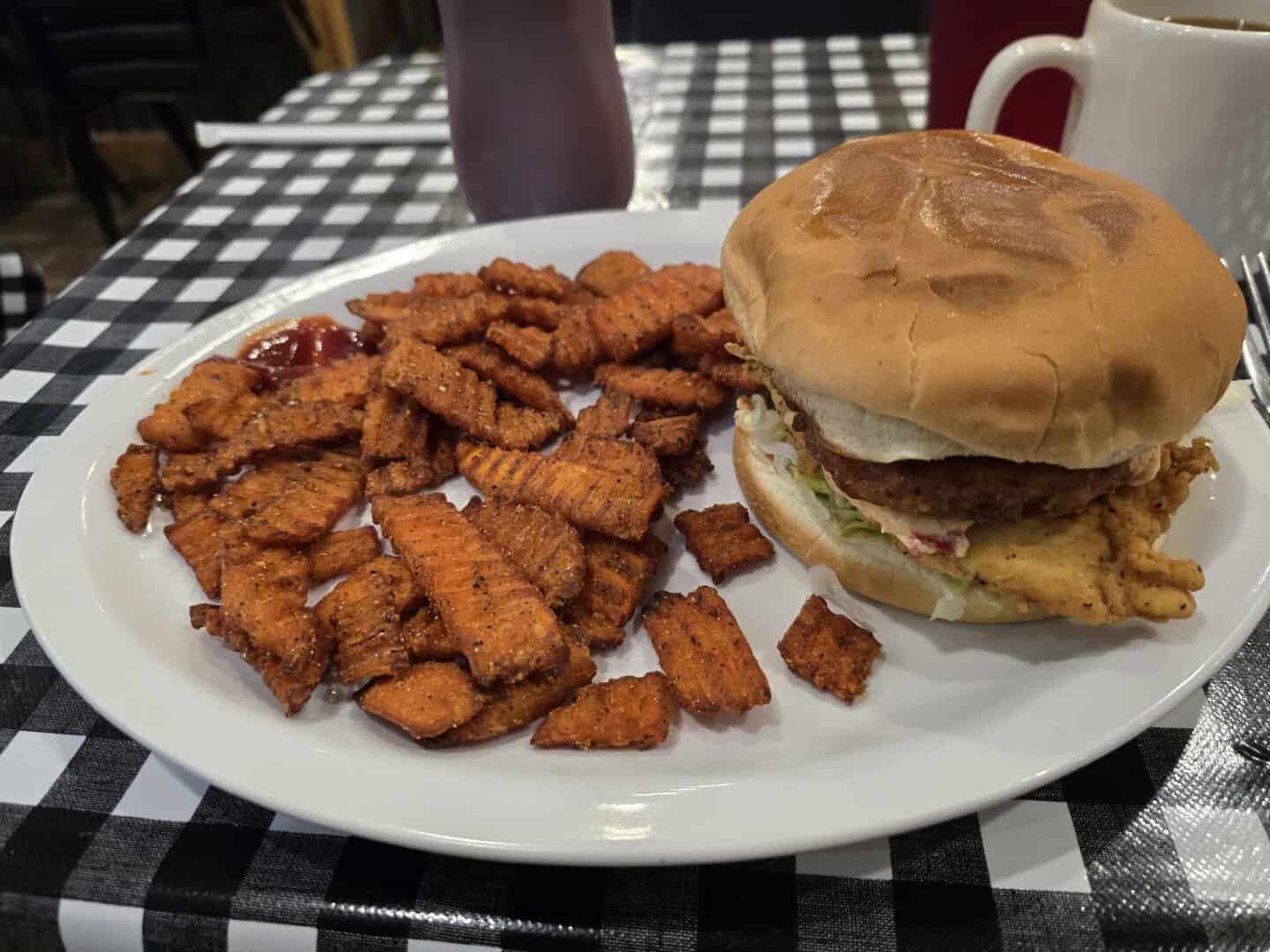 Fried chicken sandwich with sweet potato fries at Mels Country Cafe in Tomball, Texas