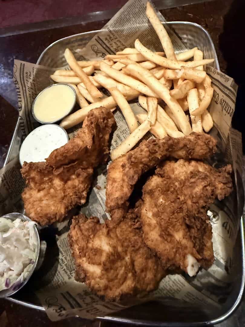 Basket of hand breaded chicken tenders and fries at Uncle Buck's Fishbowl and Grill in Round Rock