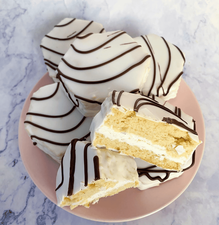 Chocolate gluten-free cake with a sliced piece at Sweet Gilly's