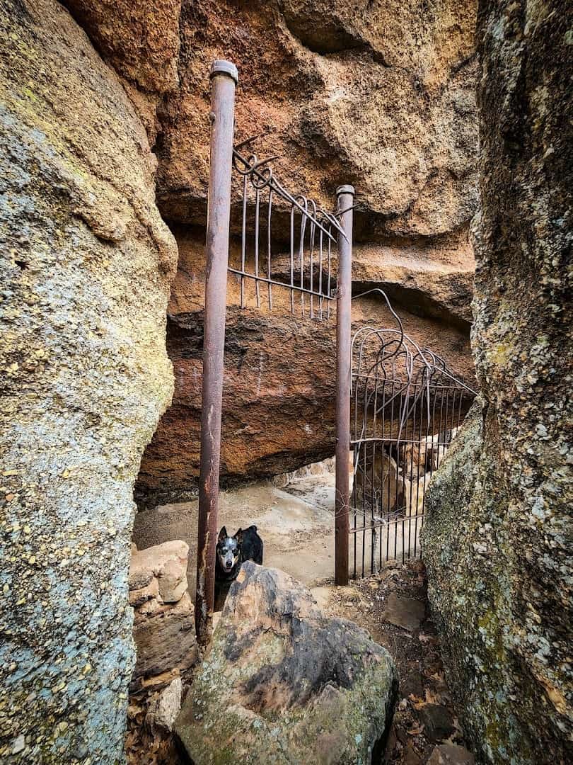 Rusted iron gate of an old animal pen set into the rocks at the abandoned Cisco zoo