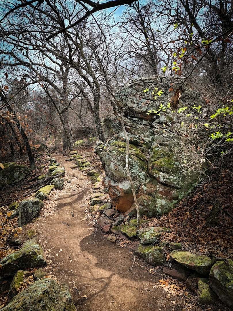 Rocky nature trail winding through the woods at the Old Zoo Nature Trails in Cisco, Texas