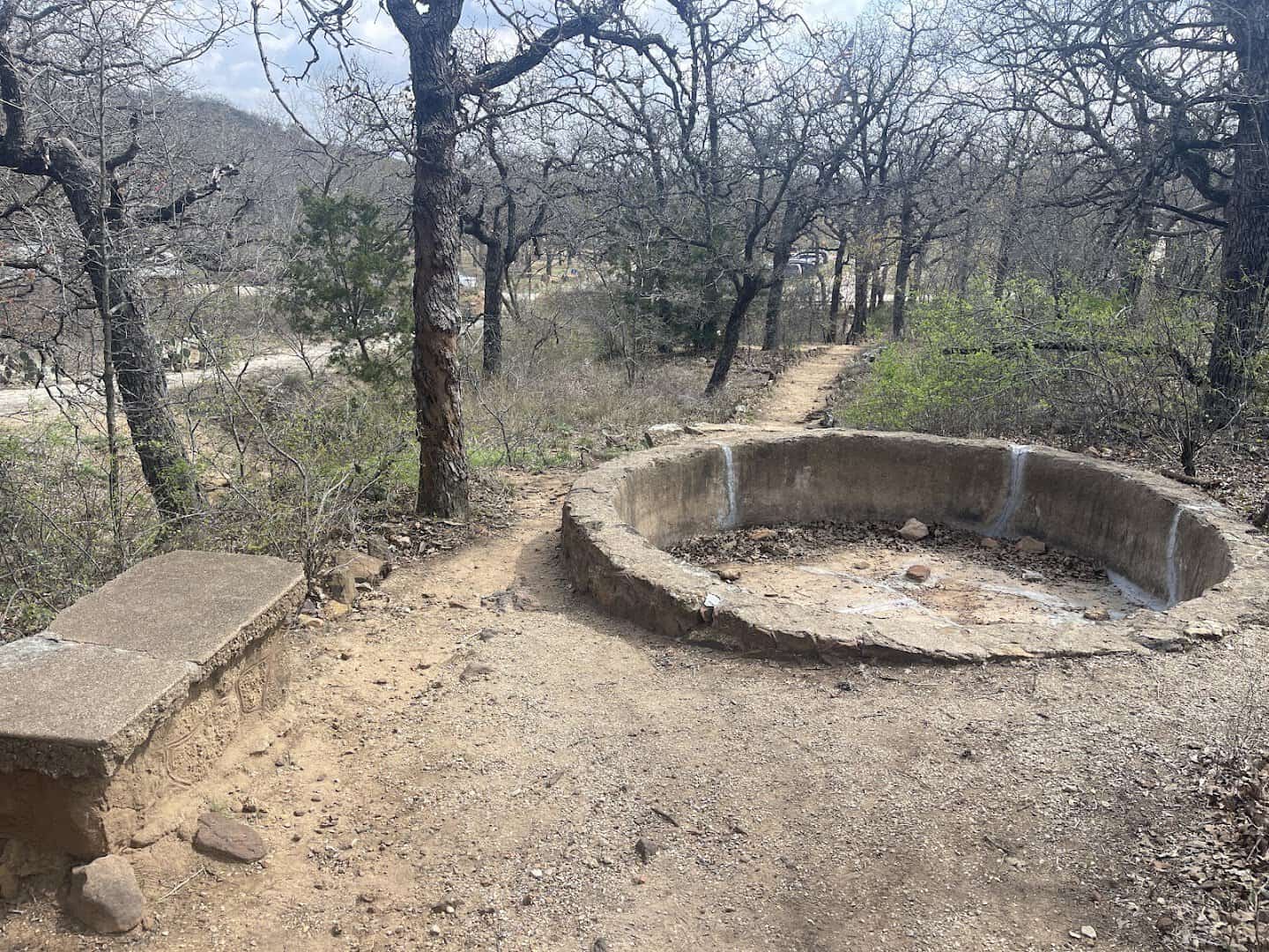 Round concrete animal enclosure ruins along the Old Zoo Nature Trails in Cisco, Texas