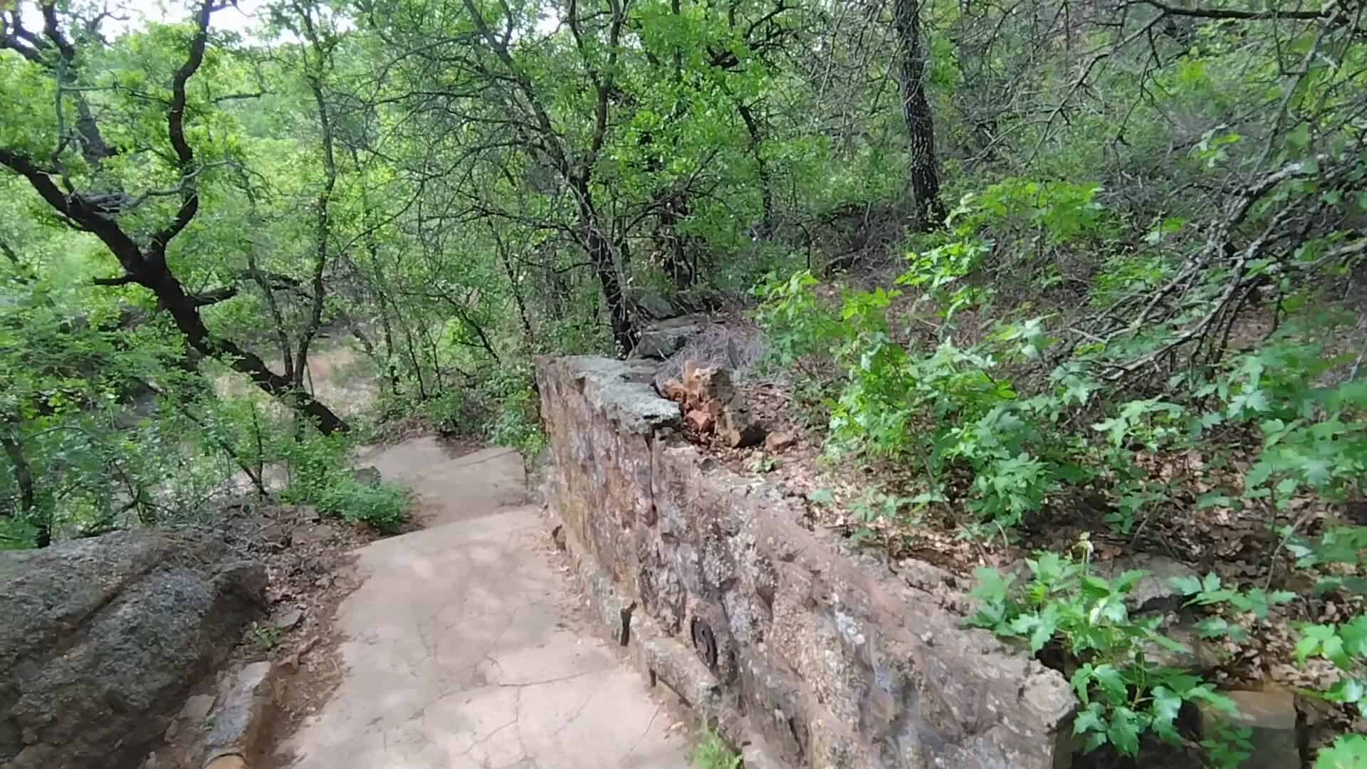 Old stone wall beside the nature trail at the abandoned Cisco zoo in Texas