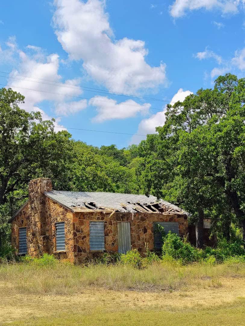 Weathered stone building from the abandoned zoo at the Old Zoo Nature Trails in Cisco, Texas