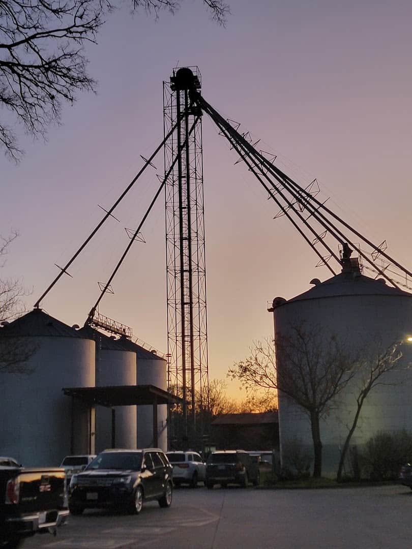 The old Clear Spring cotton gin silo behind the restaurant at dusk in New Braunfels