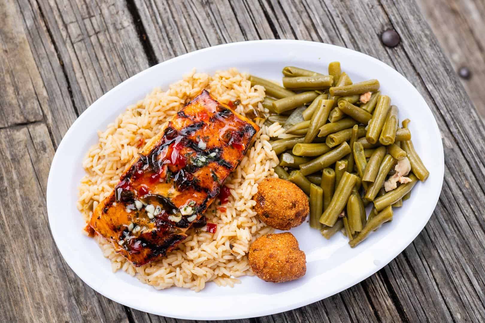 Grilled firecracker salmon with rice and green beans at Clear Springs Restaurant