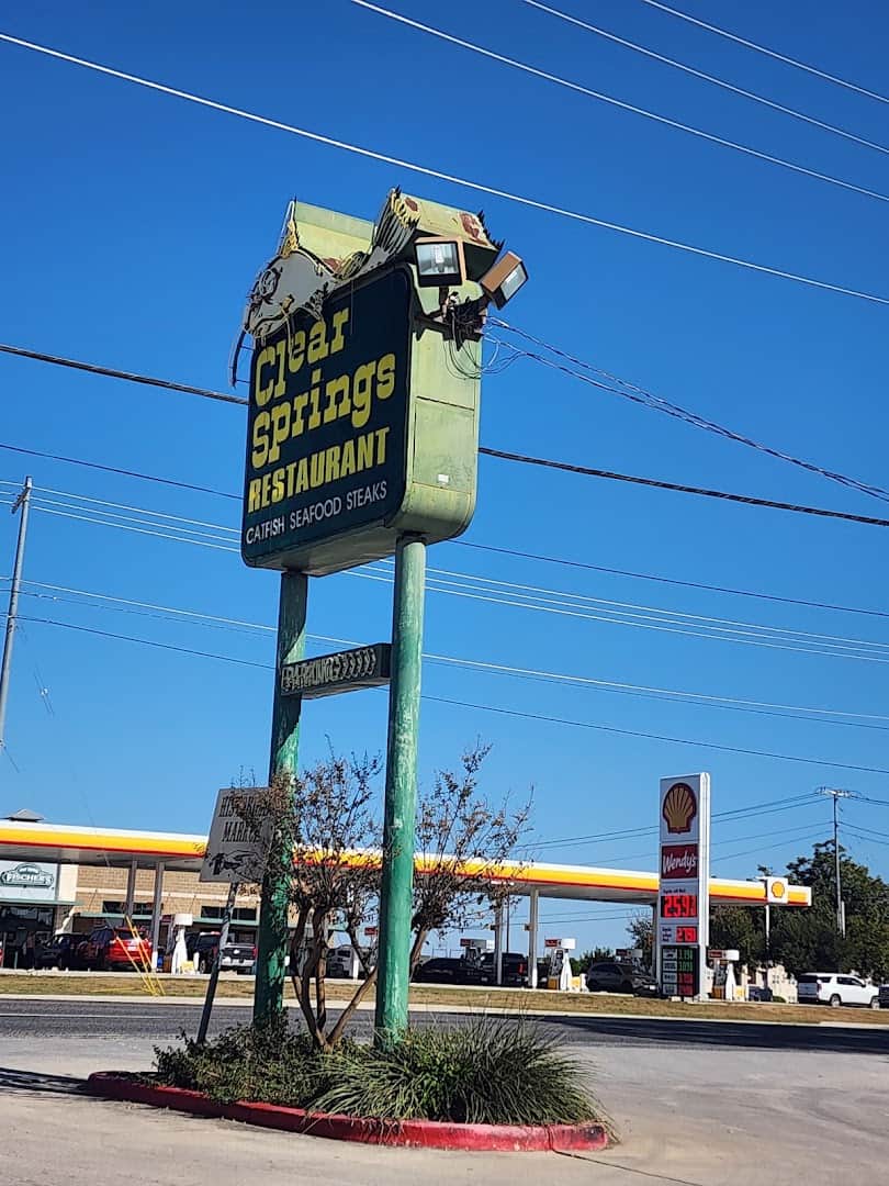 The tall Clear Springs Restaurant pole sign beside the highway in New Braunfels