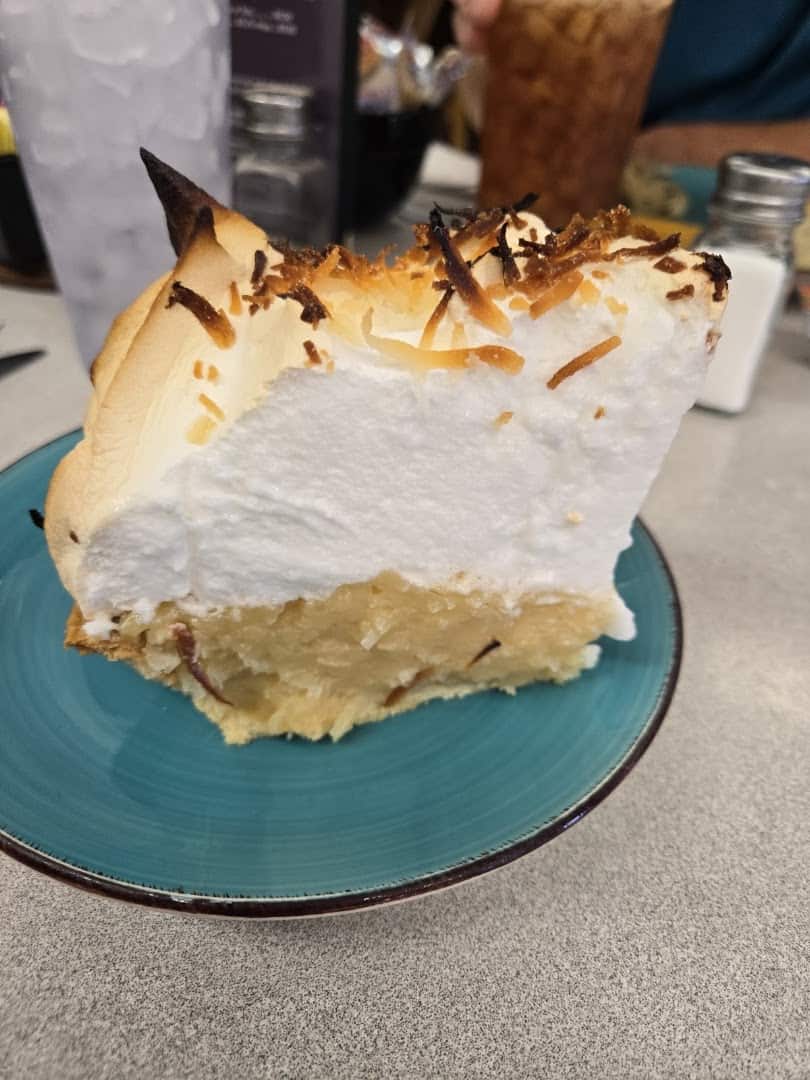 Slice of toasted coconut meringue pie at Whistle Stop Cafe in Decatur, Texas