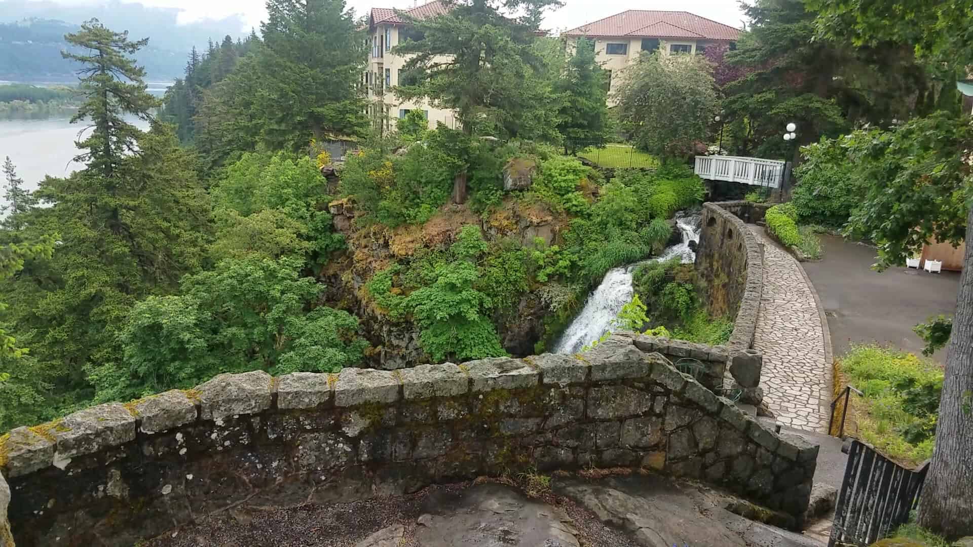 The Columbia Gorge Hotel, its waterfall, and the Columbia River in Hood River, Oregon