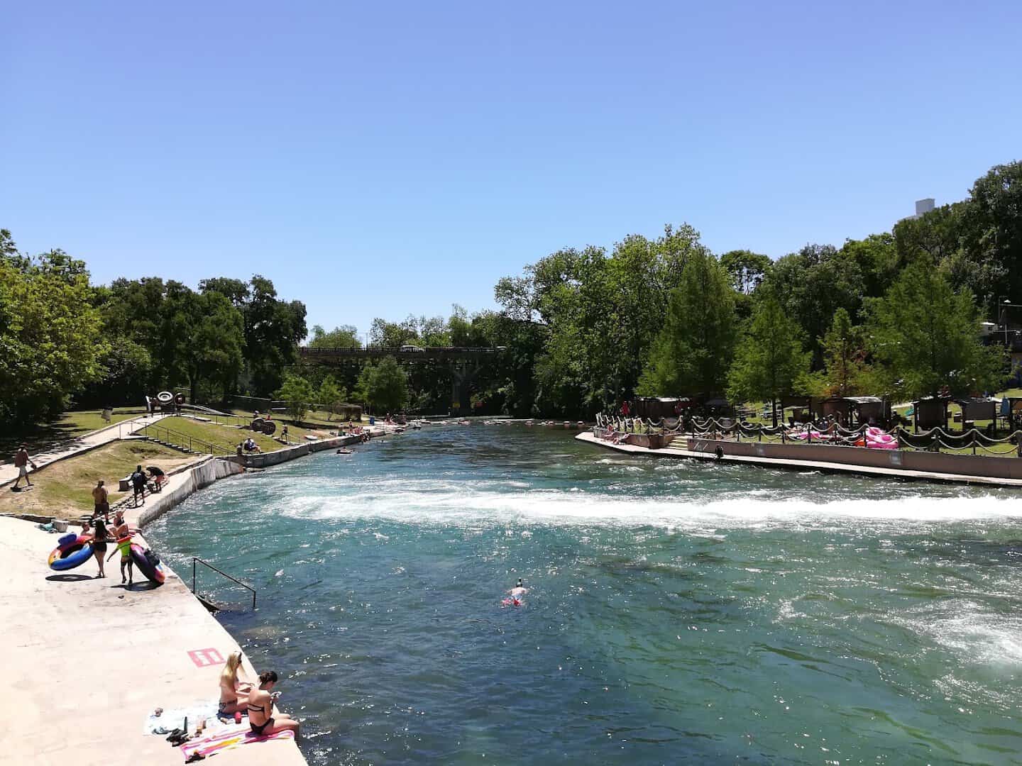 The city tube chute sending whitewater into the Comal River near Hinman Island Park