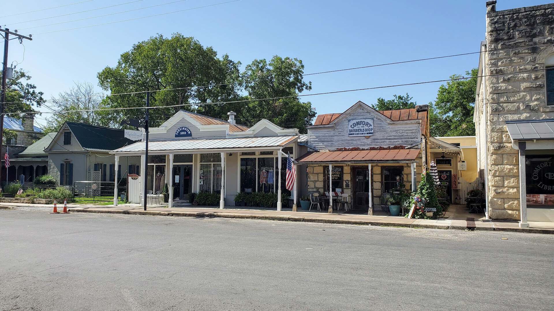 Historic limestone storefronts along High Street in Comfort, Texas