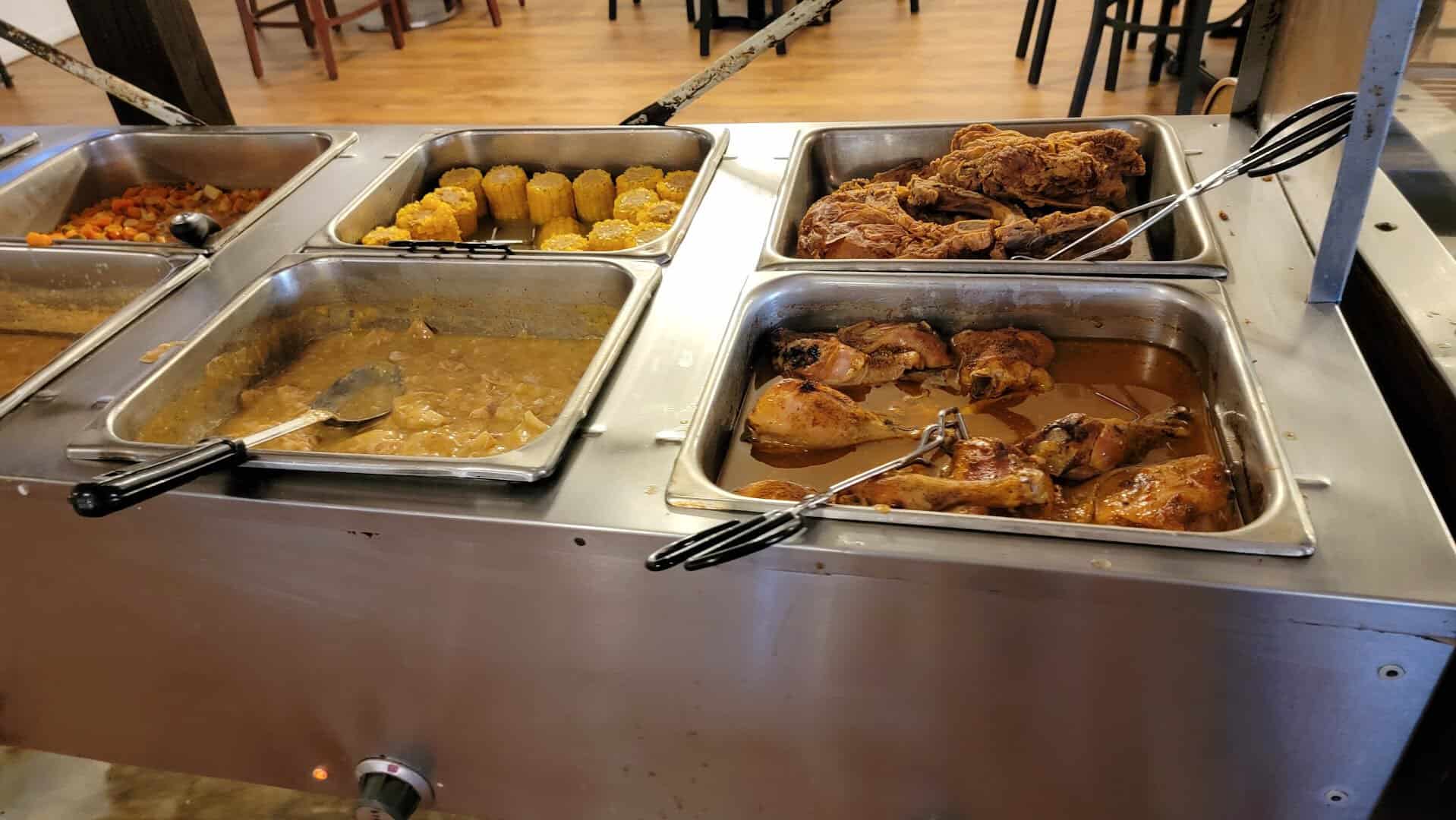 Soul food buffet trays at Cookie's Soul Food Kitchen in Ames, Texas