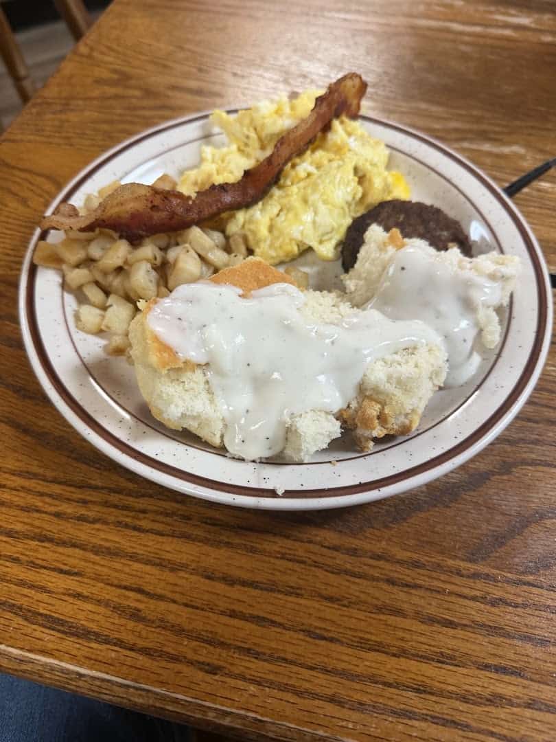 Country breakfast with eggs, bacon, sausage and biscuits with cream gravy at Sam's Original Restaurant in Fairfield, Texas