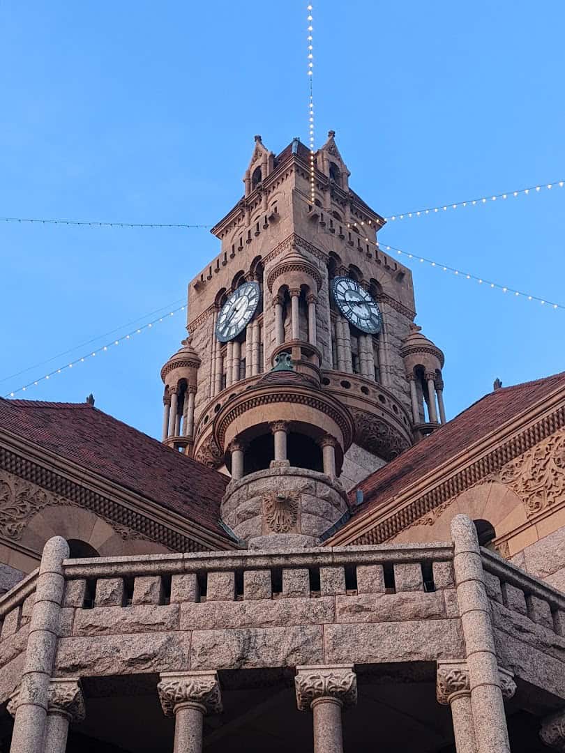 Detail of the courthouse tower and pink granite arches