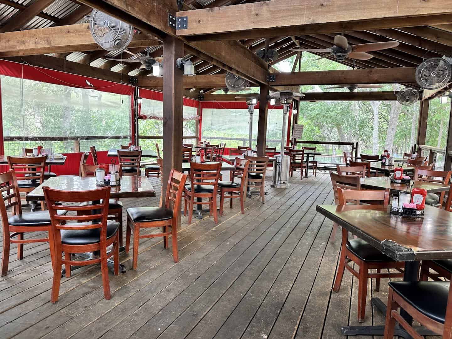 Covered outdoor patio with tables at Richter's Antler Cafe in Spring Branch