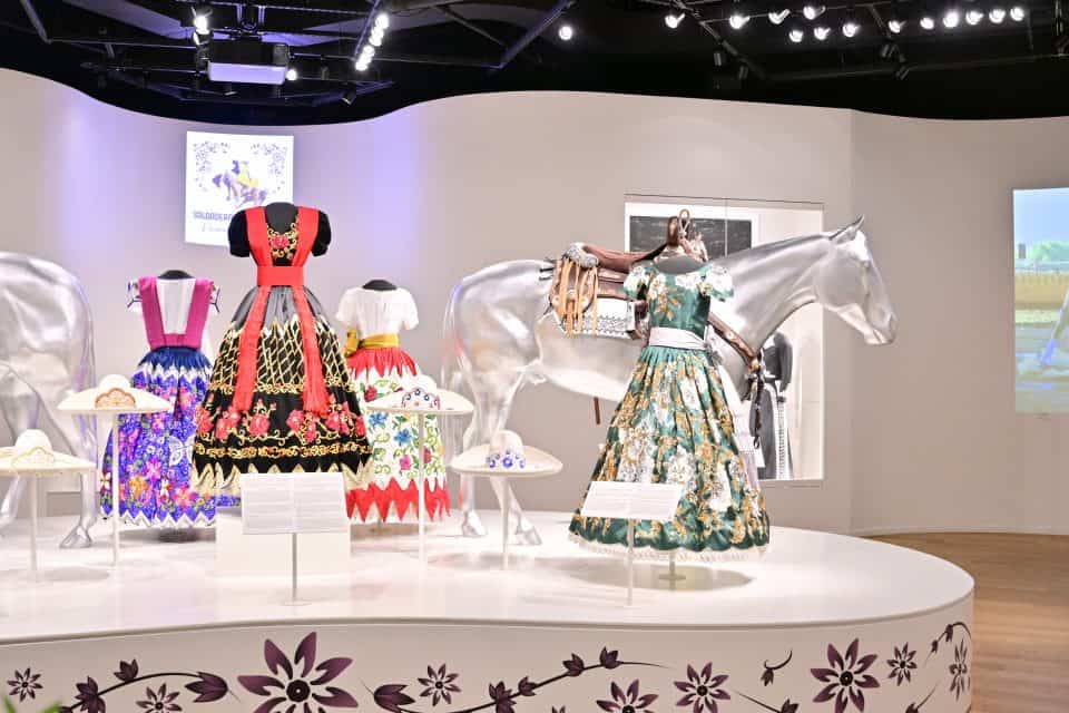 Soldaderas to Amazonas escaramuza exhibit with charra dresses at the National Cowgirl Museum