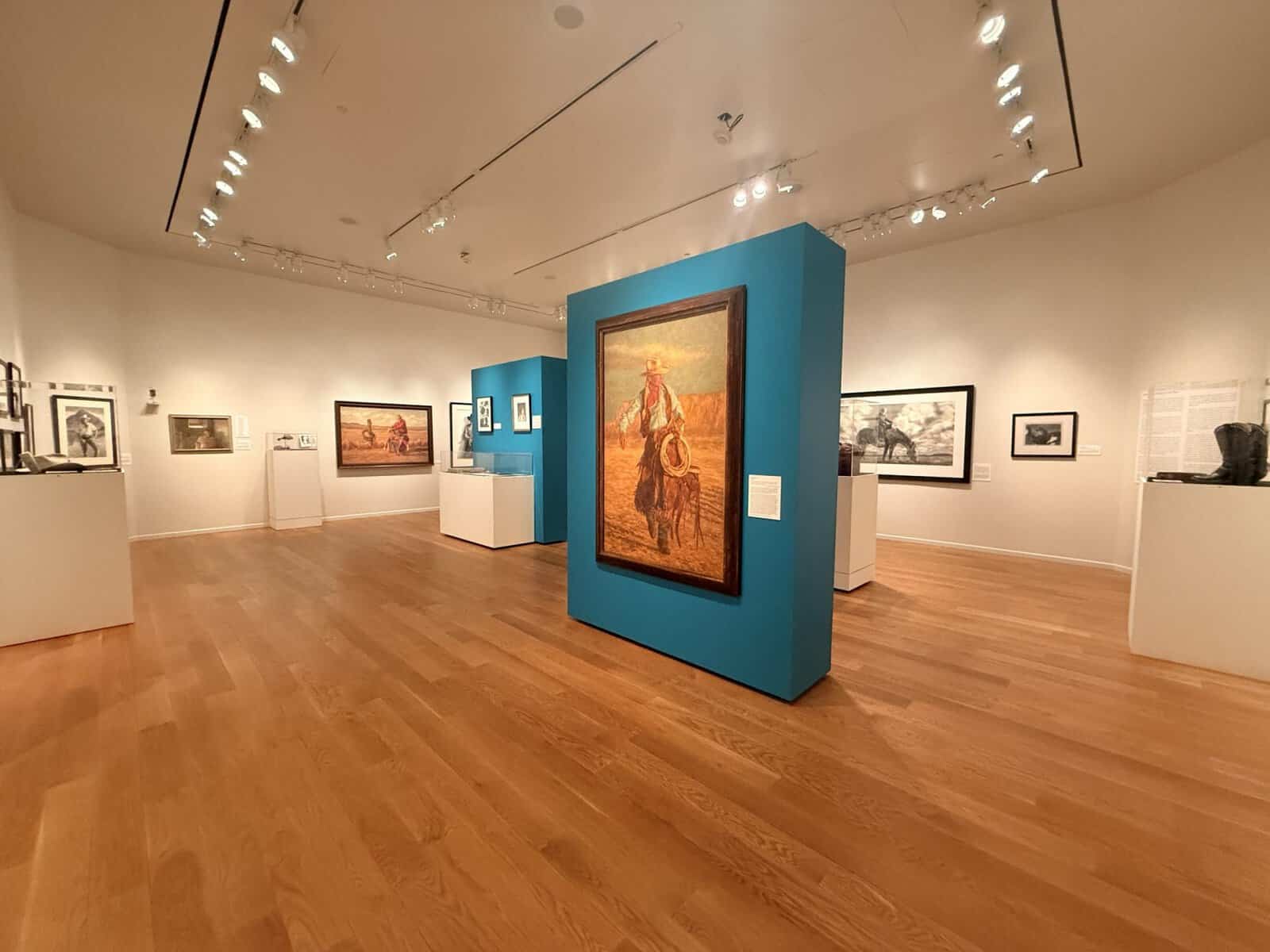 Gallery with a large cowgirl painting at the National Cowgirl Museum in Fort Worth