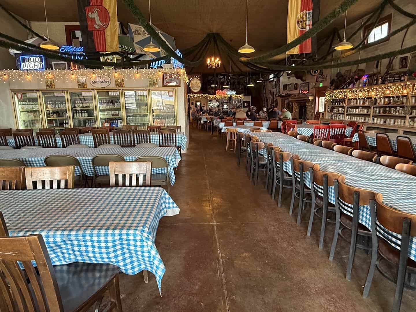 Cozy dining room with checkered tablecloths inside the 1882 Walburg mercantile