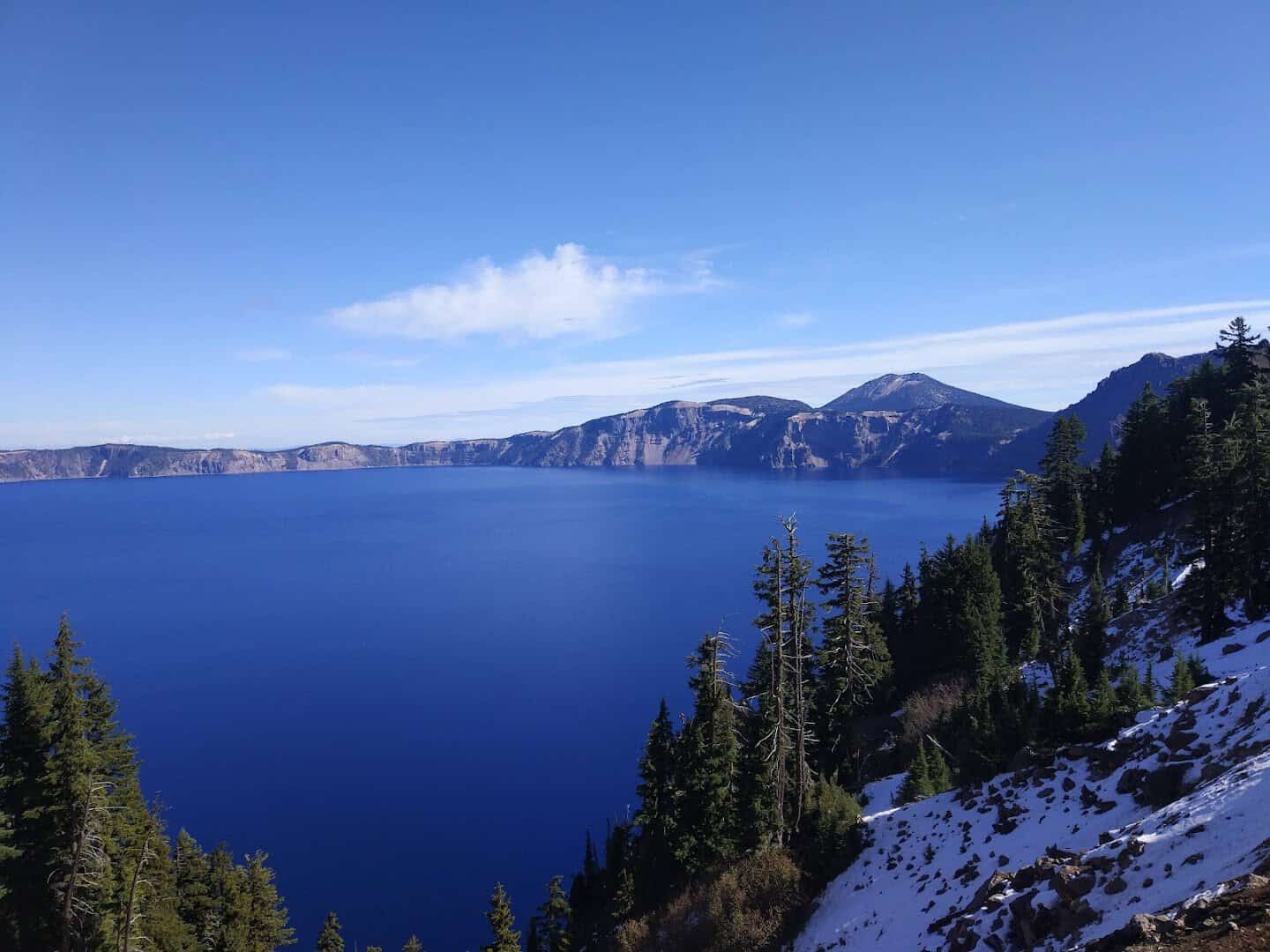 Snow along the rim above Crater Lake and Wizard Island in winter, Oregon