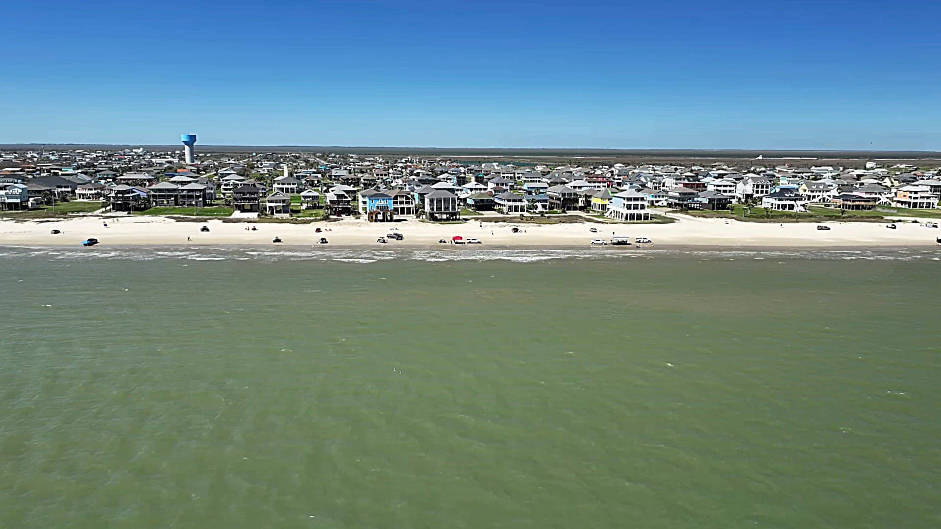 Beach houses on stilts along the Crystal Beach shoreline on Bolivar Peninsula