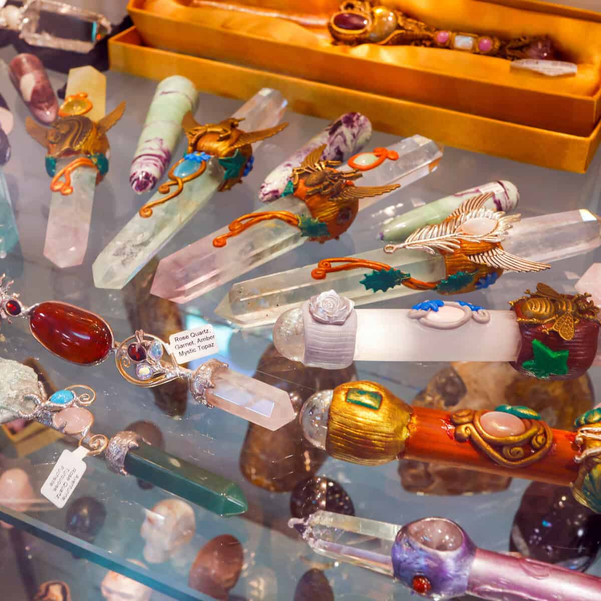 Display case of crystal wands and stone jewelry at Nature's Treasures in Austin