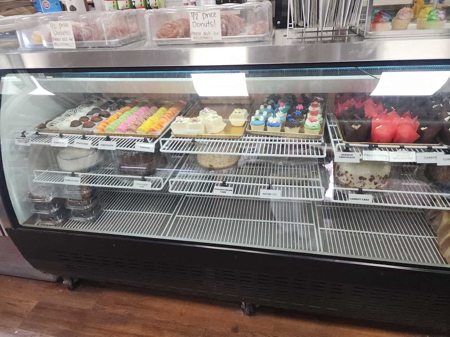 Cupcakes and cakes in the glass case at Naegelin's Bakery in New Braunfels