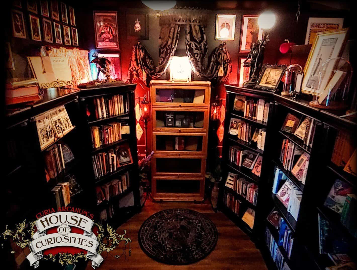 Antique occult and folklore books on shelves at Curia Arcanum in Austin, Texas