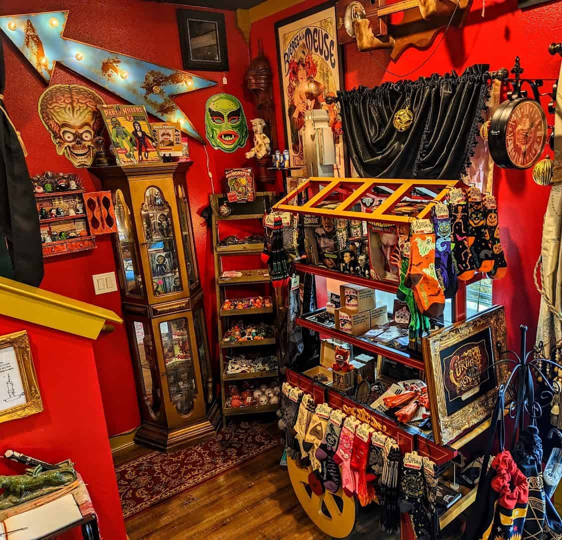 Shelves packed with gothic oddities and curiosities at Curia Arcanum in Austin, Texas