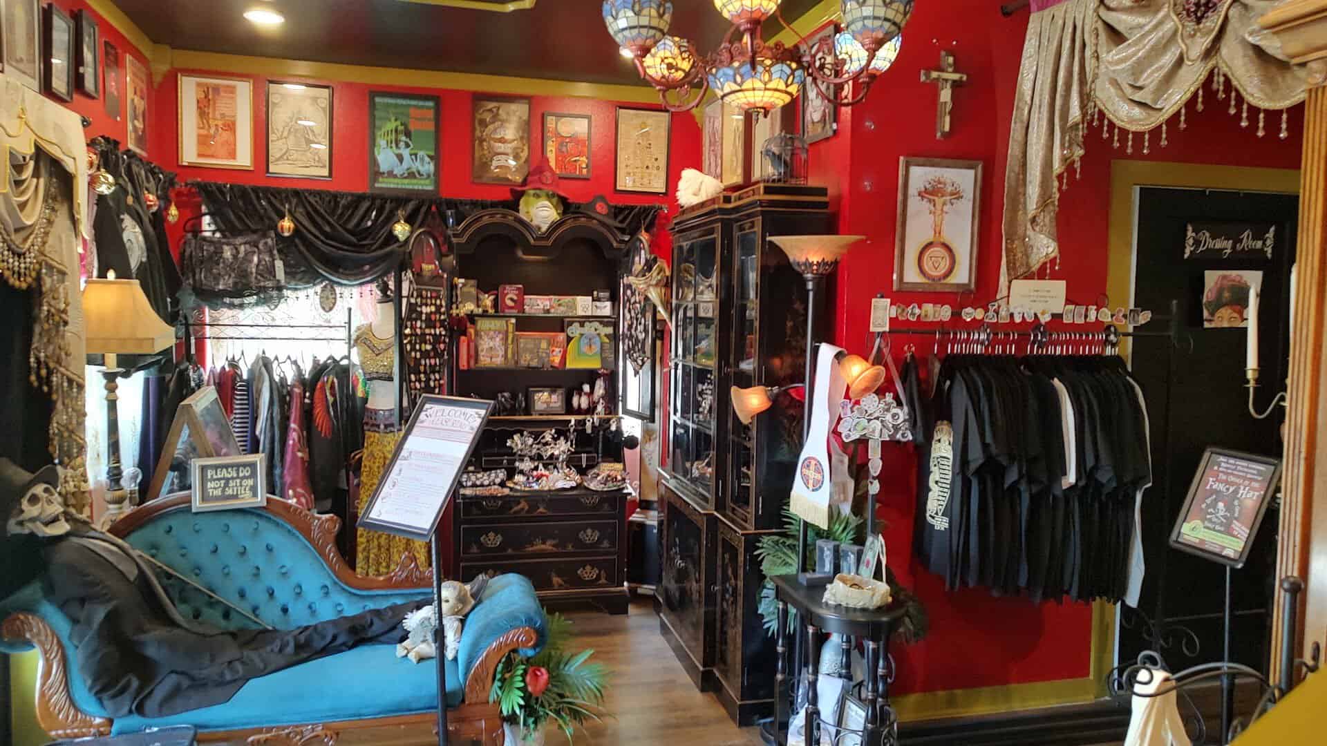 Victorian sitting room with fainting couch and framed art at Curia Arcanum in Austin, Texas
