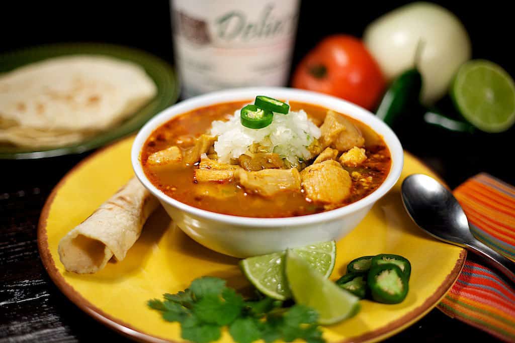 Bowl of caldo with tortillas at Delia's Tamales in McAllen, Texas