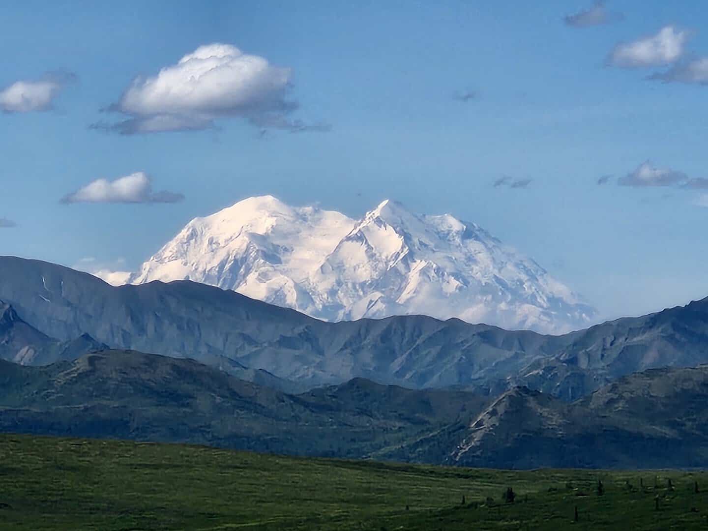 The snow-covered Denali massif rising above the tundra, Denali National Park, Alaska
