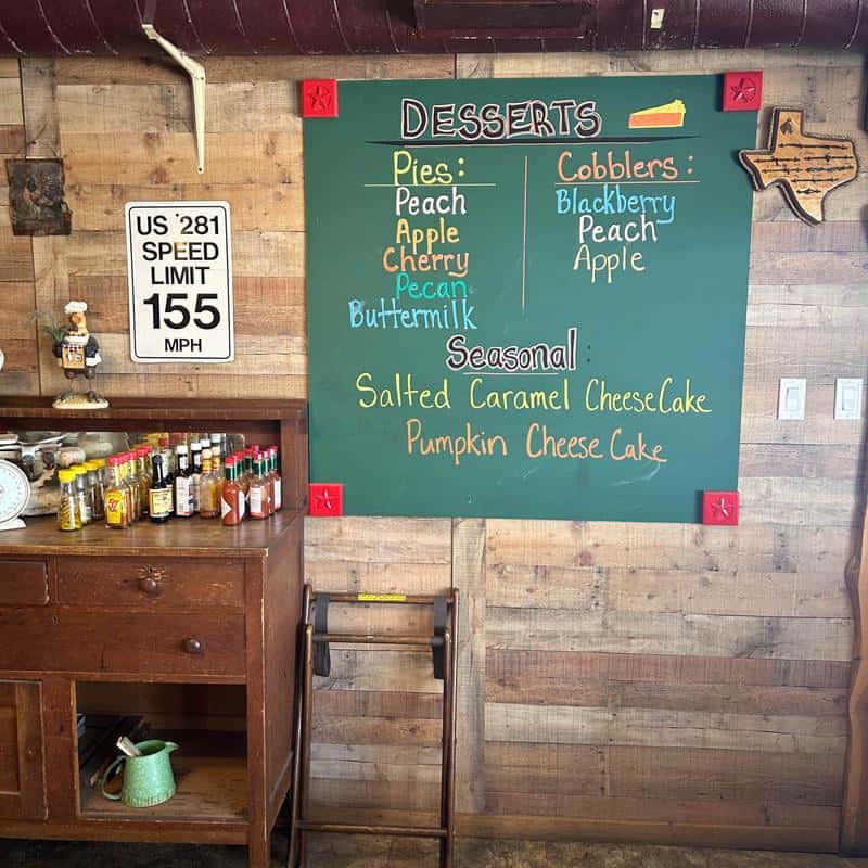 Handwritten dessert and cobbler specials chalkboard at Hill Country Cupboard
