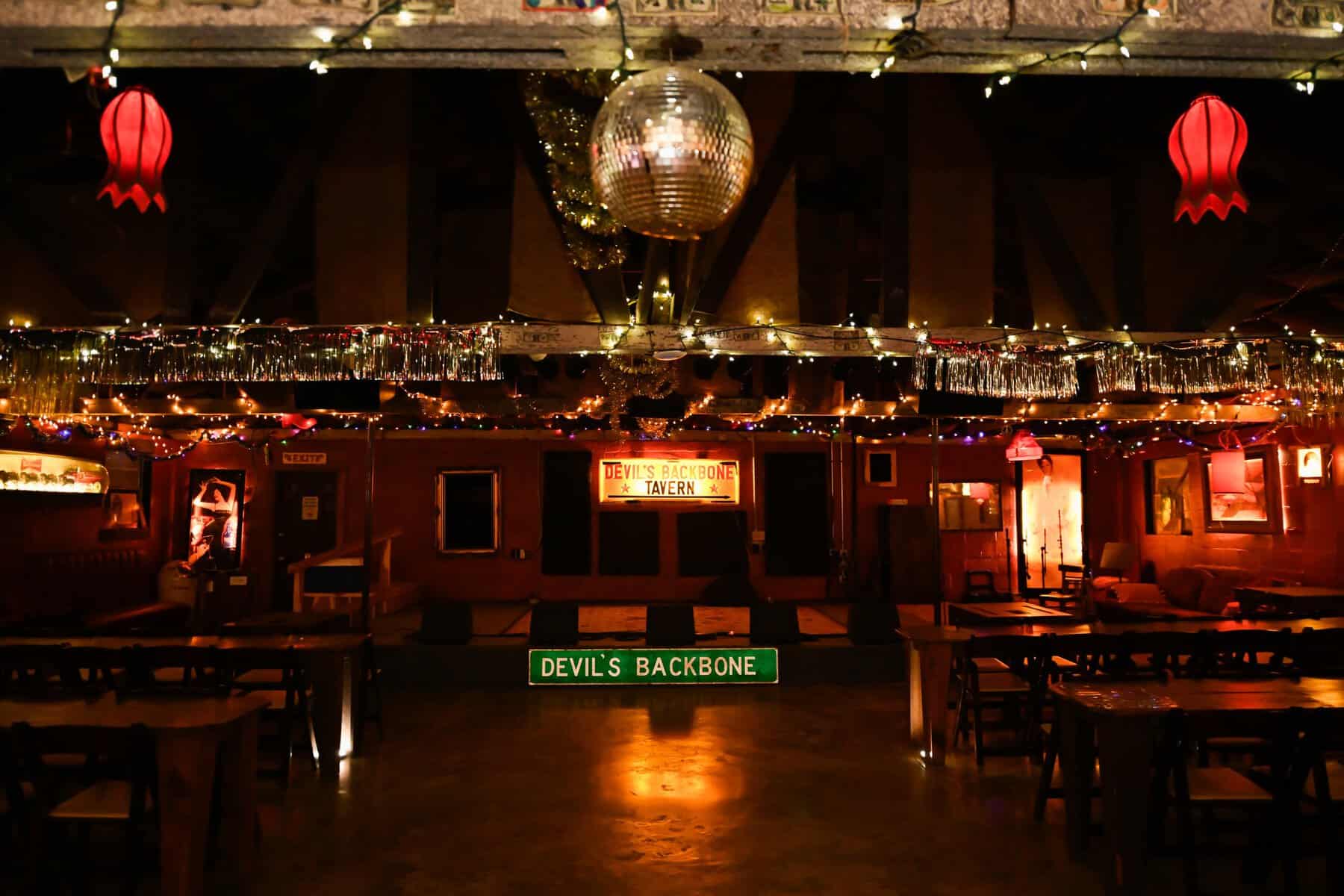 The dance hall and stage lit up at night at Devil's Backbone Tavern in Fischer, Texas