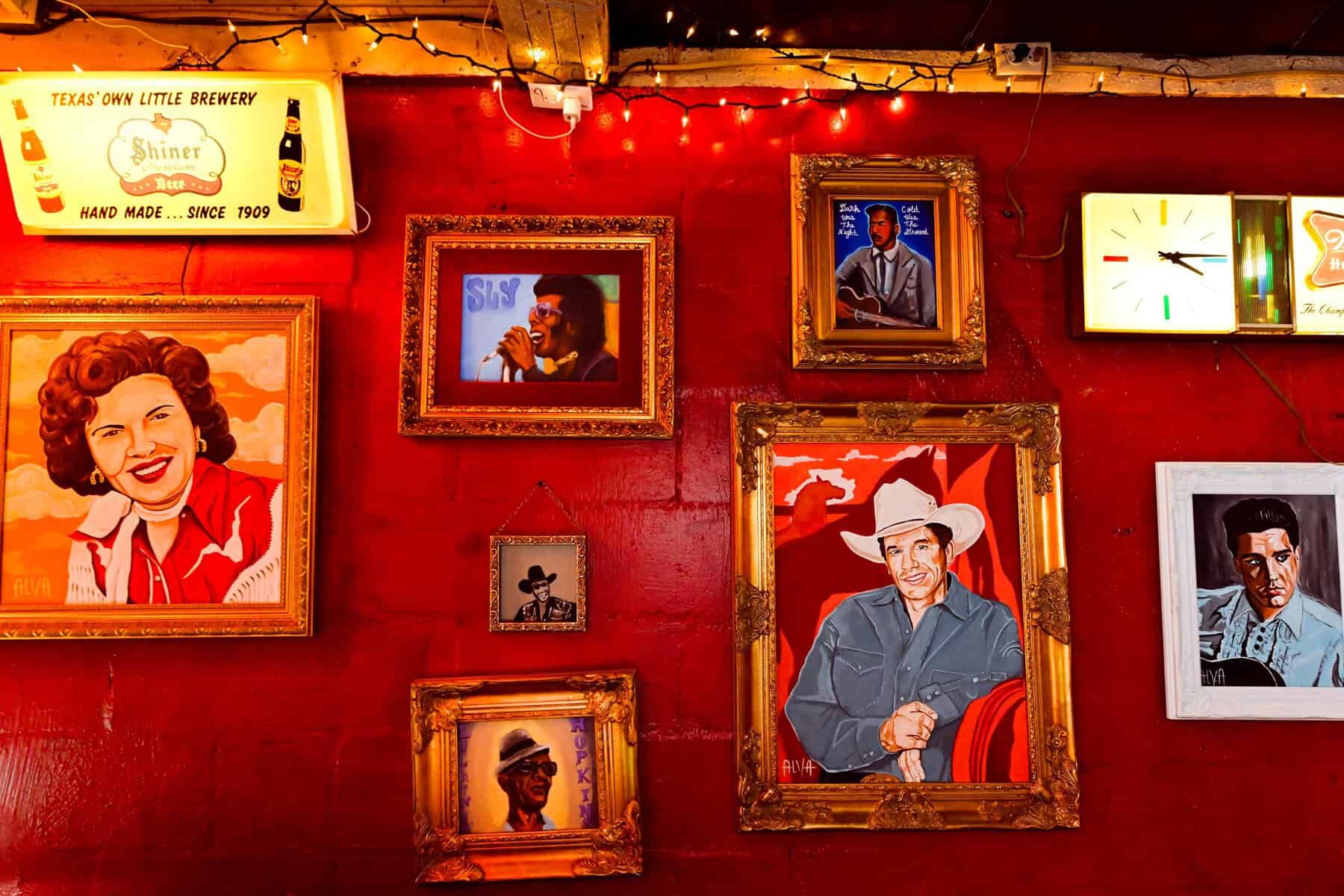 Painted portraits of country and blues musicians on the wall at Devil's Backbone Tavern in Fischer, Texas