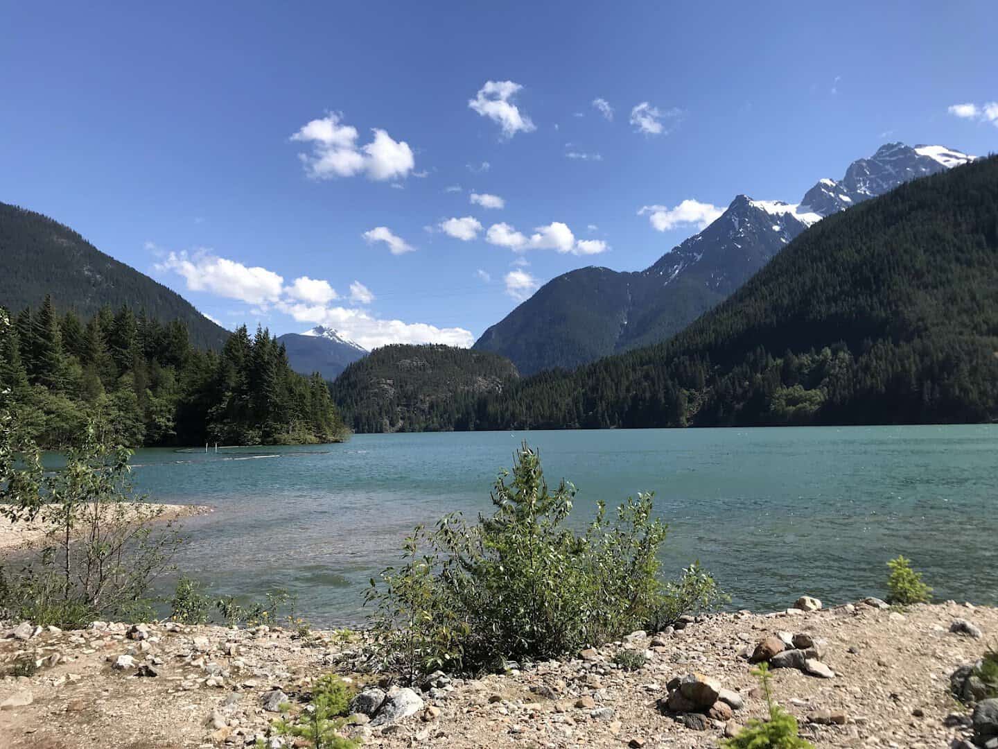 Turquoise glacial water of Diablo Lake ringed by forested peaks, North Cascades, Washington