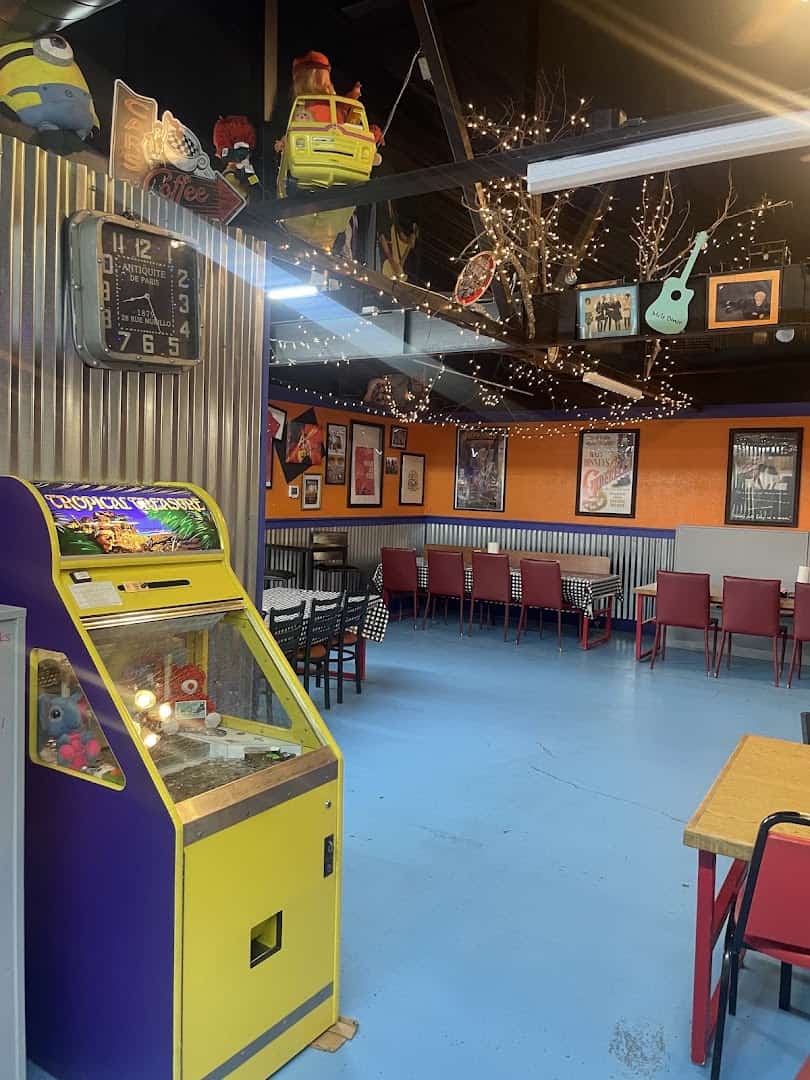 Arcade game and dining room at Mel's Diner in Mingus, Texas