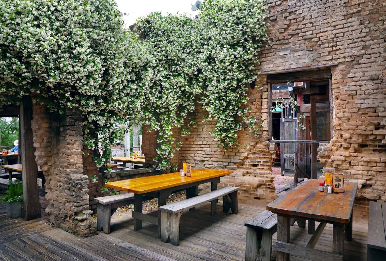 Dining tables set in the stone ruins of the 1878 Gruene cotton gin