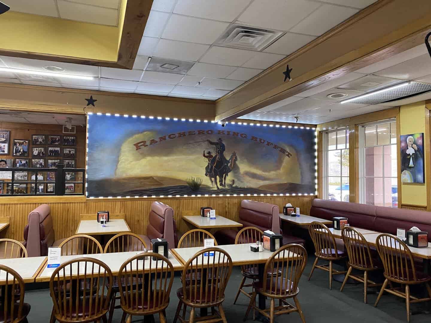 Dining room with a Western mural at Ranchero King Buffet in Houston