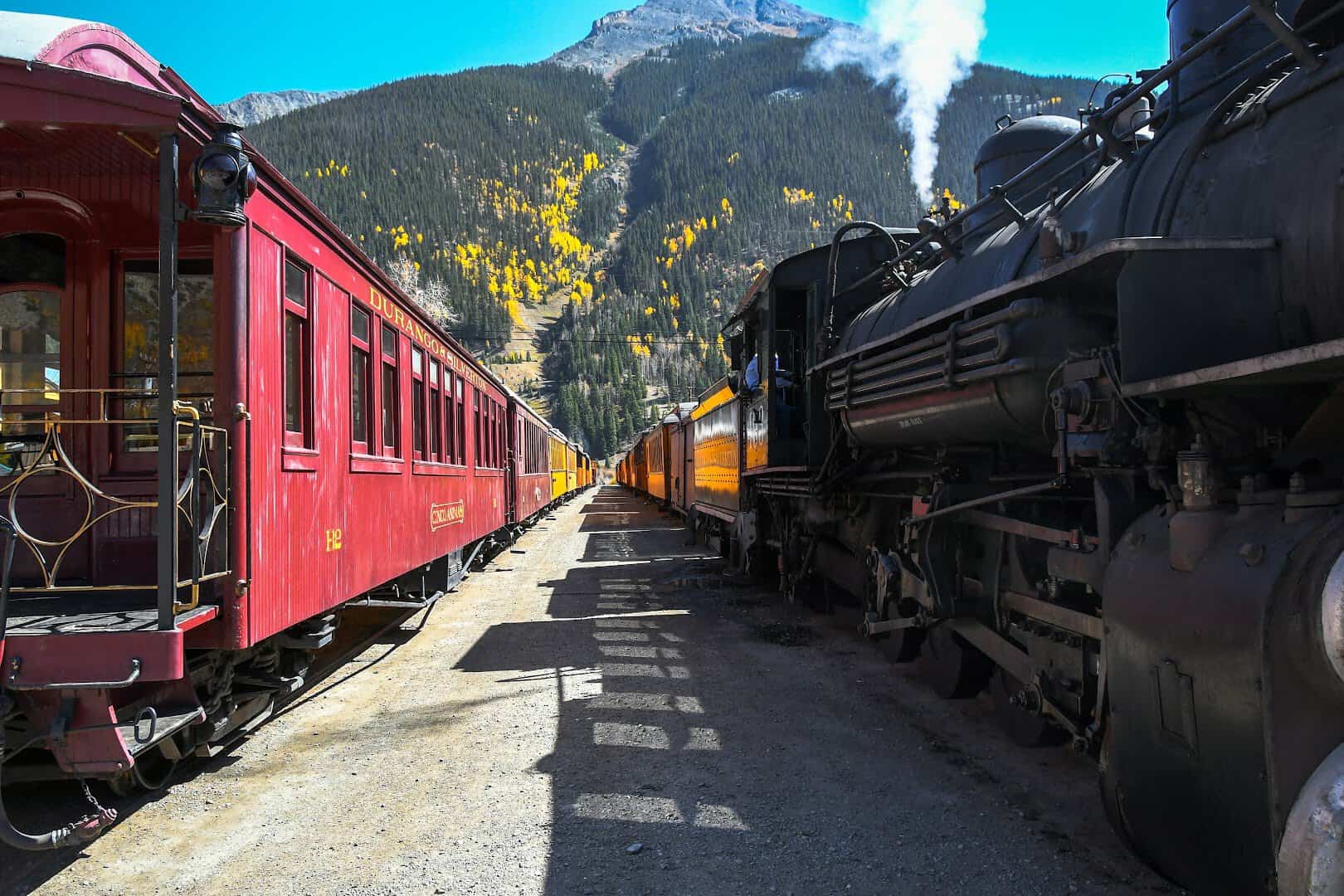 Durango and Silverton Narrow Gauge Railroad steam train with golden aspens, Colorado