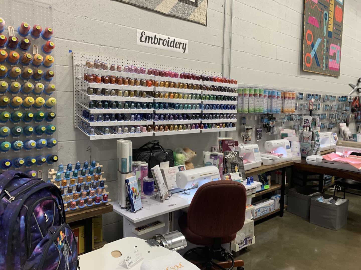 Wall of embroidery thread and sewing machines at Wherehouse Fabrics in Dallas
