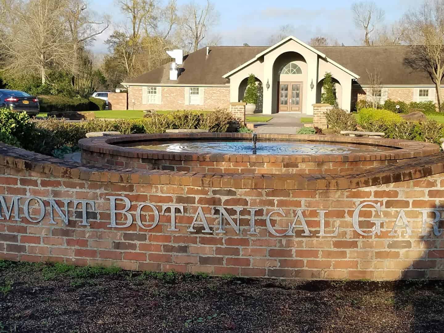 Brick entrance sign and Garden Center building at Beaumont Botanical Gardens