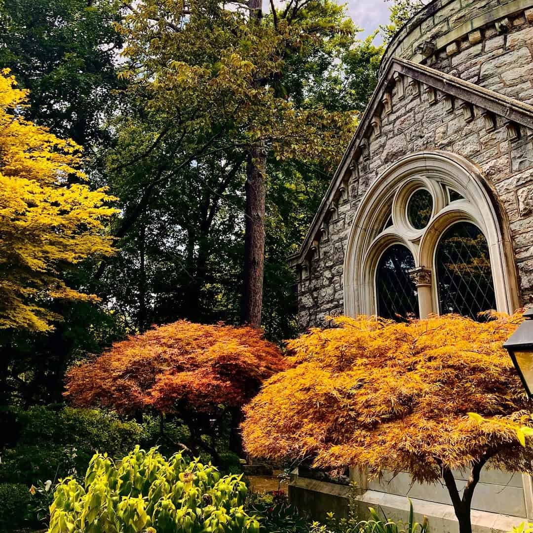 Stone church framed by golden autumn maples, Eureka Springs, Arkansas