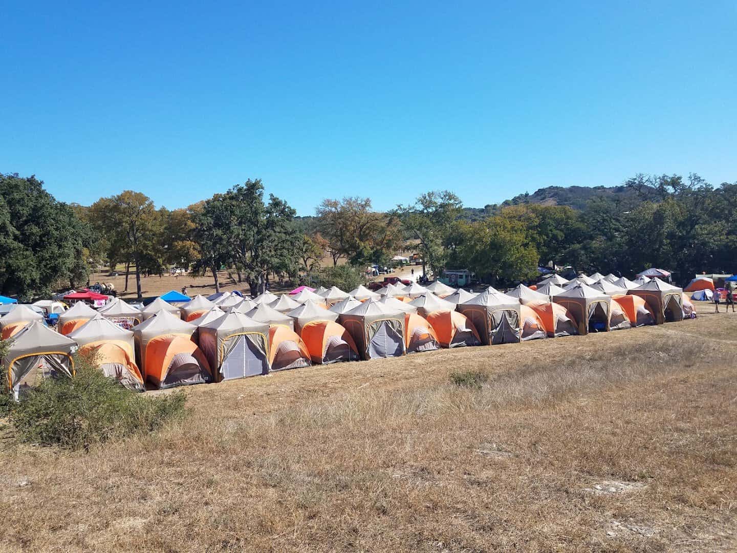 Rows of tents on an event weekend at Flat Rock Ranch in Comfort, Texas