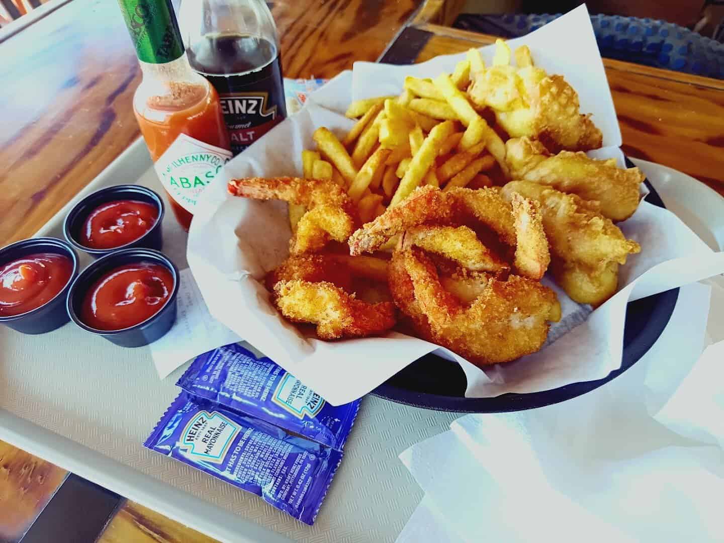 Fish and chips with dipping sauces at Snoopy's Pier in Corpus Christi