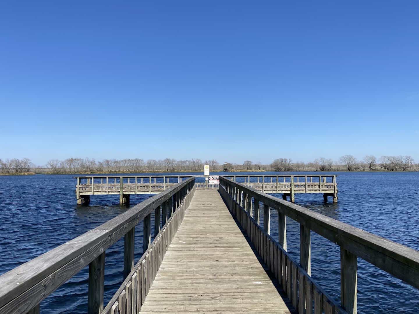 Fishing pier over a lake at Brazos Bend State Park, Texas