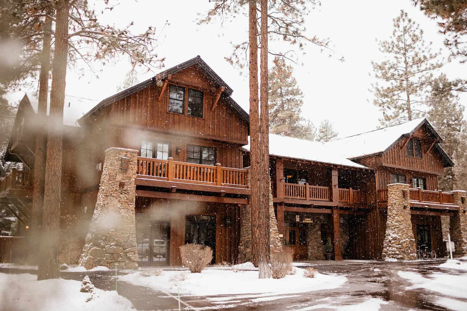 Timber lodge building surrounded by fresh snow, FivePine Lodge, Sisters, Oregon