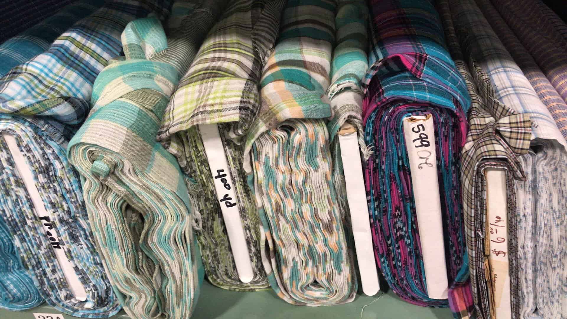 Folded stacks of patterned fabric at Wherehouse Fabrics in Dallas