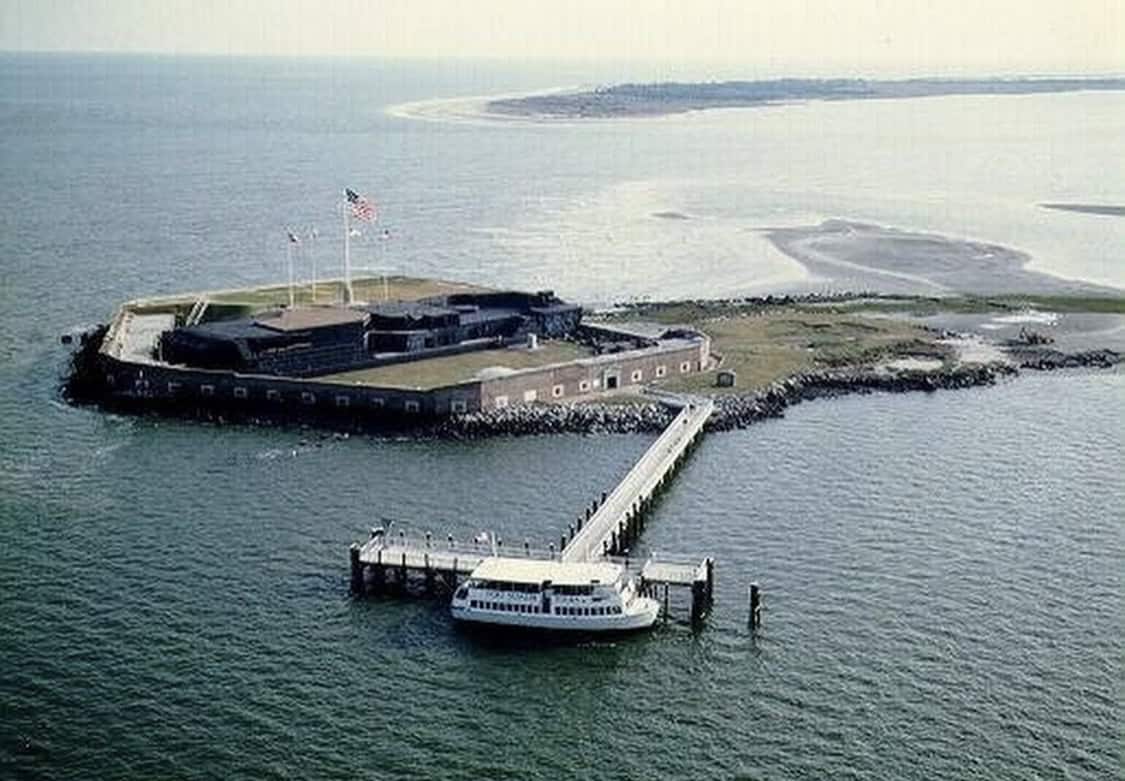 Aerial view of Fort Sumter on its island with the ferry dock in Charleston Harbor, SC