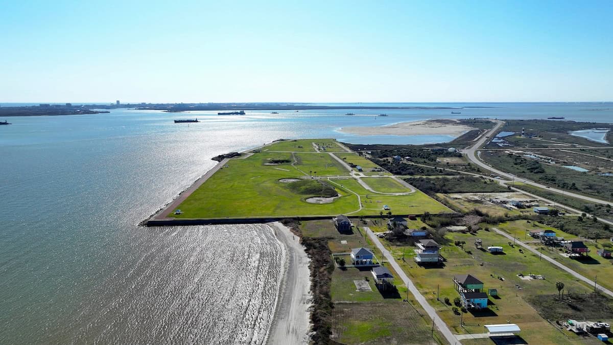 Aerial view of Fort Travis Seashore Park at the tip of Bolivar Peninsula with Galveston Bay beyond