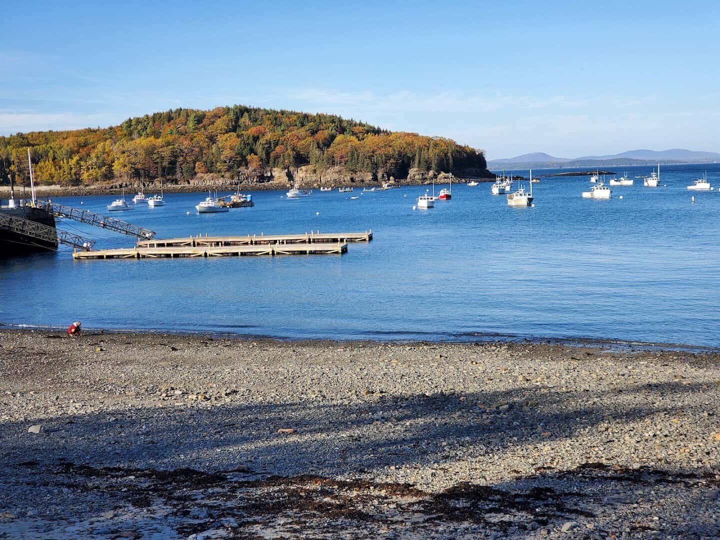 Rocky shoreline over steel-blue Frenchman Bay near Agamont Park, Bar Harbor, Maine